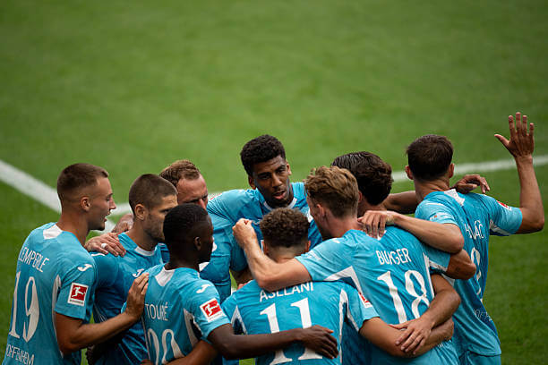 Bundesliga Roundup, Matchday 1: Fisnik Asllani celebrates his goal with his teammates during the Bundesliga match between Bayer Leverkusen and TSG Hoffenheim at the BayArena on August 23, 2025.