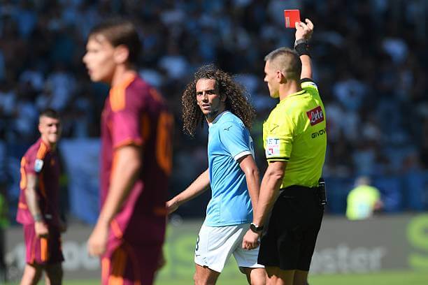 Lazio vs AS Roma Review: Referee Simone Sozza shows Matteo Guendouzi a red card during the Serie A match between Lazio and AS Roma at the Stadio Olimpico on September 21, 2025.