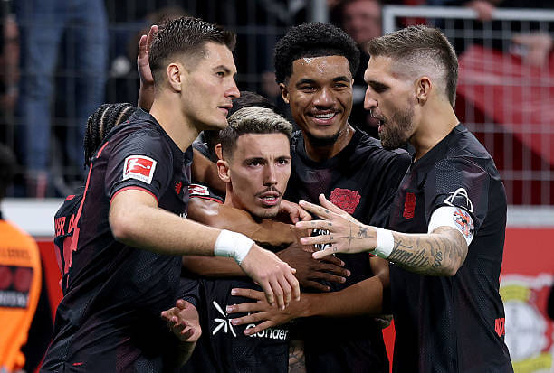 Bundesliga Roundup, Matchday 3: Alex Grimaldo celebrates with his teammates during the Bundesliga match between Bayer Leverkusen and Eintracht Frankfurt at the BayArena on September 12, 2025.