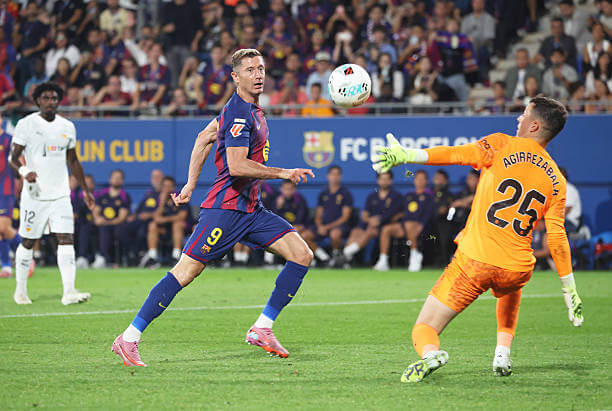 Barcelona vs Valencia Review: Robert Lewandowski scores his second goal of the game during the La Liga match between Barcelona and Valencia at the Estadi Johan Cruyff on September 14, 2025.