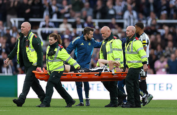 Newcastle vs Arsenal Review: Tino Livramento is stretchered off with an injury during the Premier League match between Newcastle and Arsenal at St James' Park on September 28, 2025.