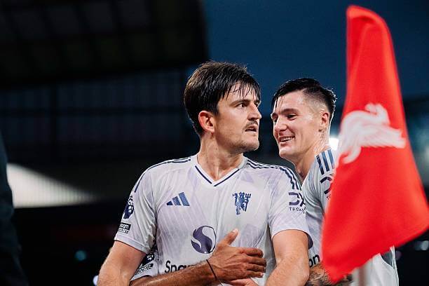 Liverpool vs Manchester United Review: Harry Maguire celebrates his goal with his teammate during the Premier League match between Liverpool and Manchester United at Anfield on October 19, 2025.