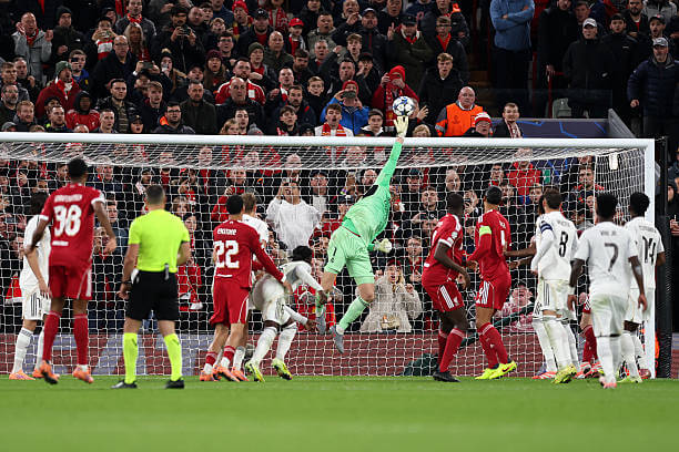 Liverpool vs Real Madrid Review: Thibaut Courtois saves a header from Hugo Ekitike during the UEFA Champions League 2025/26 League Phase MD4 match between Liverpool and Real Madrid at Anfield on November 4, 2025.