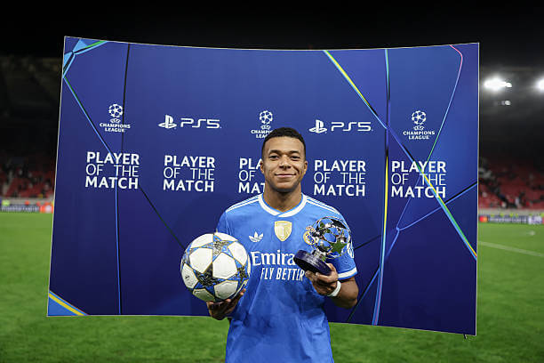 Olympiacos vs Real Madrid Review: Kylian Mbappe with the match ball and the player of the match award after the UEFA Champions League 2025/26 League Phase MD5 match between Olympiacos and Real Madrid at the Georgios Karaiskakis Stadium on November 26, 2025.