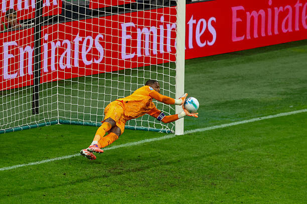 AC Milan vs AS Roma Review: Mike Maignan saves a penalty during the Serie A match between AC Milan and AS Roma at the San Siro on November 02, 2025.