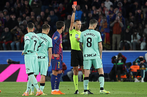Barcelona vs Athletic Bilbao Review: Referee Jose Maria Sanchez shows Oihan Sancet a red card during the La Liga match between Barcelona and Athletic Bilbao at Camp Nou on November 22, 2025.