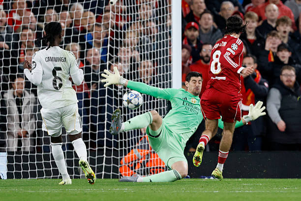 Liverpool vs Real Madrid Review: Thibaut Courtois saves a shot from Dominik Szoboszlai during the UEFA Champions League 2025/26 League Phase MD4 match between Liverpool and Real Madrid at Anfield on November 4, 2025.