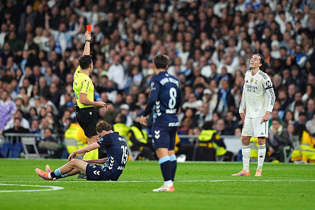 Real Madrid vs Celta Vigo Review: Alvaro Carreras is shown a red card by referee Alejandro Quintero during the La Liga match between Real Madrid and Celta Vigo at the Santiago Bernabeu on December 7, 2025.