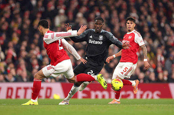 Arsenal vs Aston Villa Review: Amadou Onana is challenged by William Saliba during the Premier League match between Arsenal and Aston Villa at the Emirates Stadium on December 30, 2025.