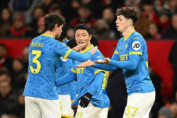 Manchester United vs Wolves Review: Wolves players celebrate during the Premier League match between Manchester United and Wolves at Old Trafford on December 30, 2025.